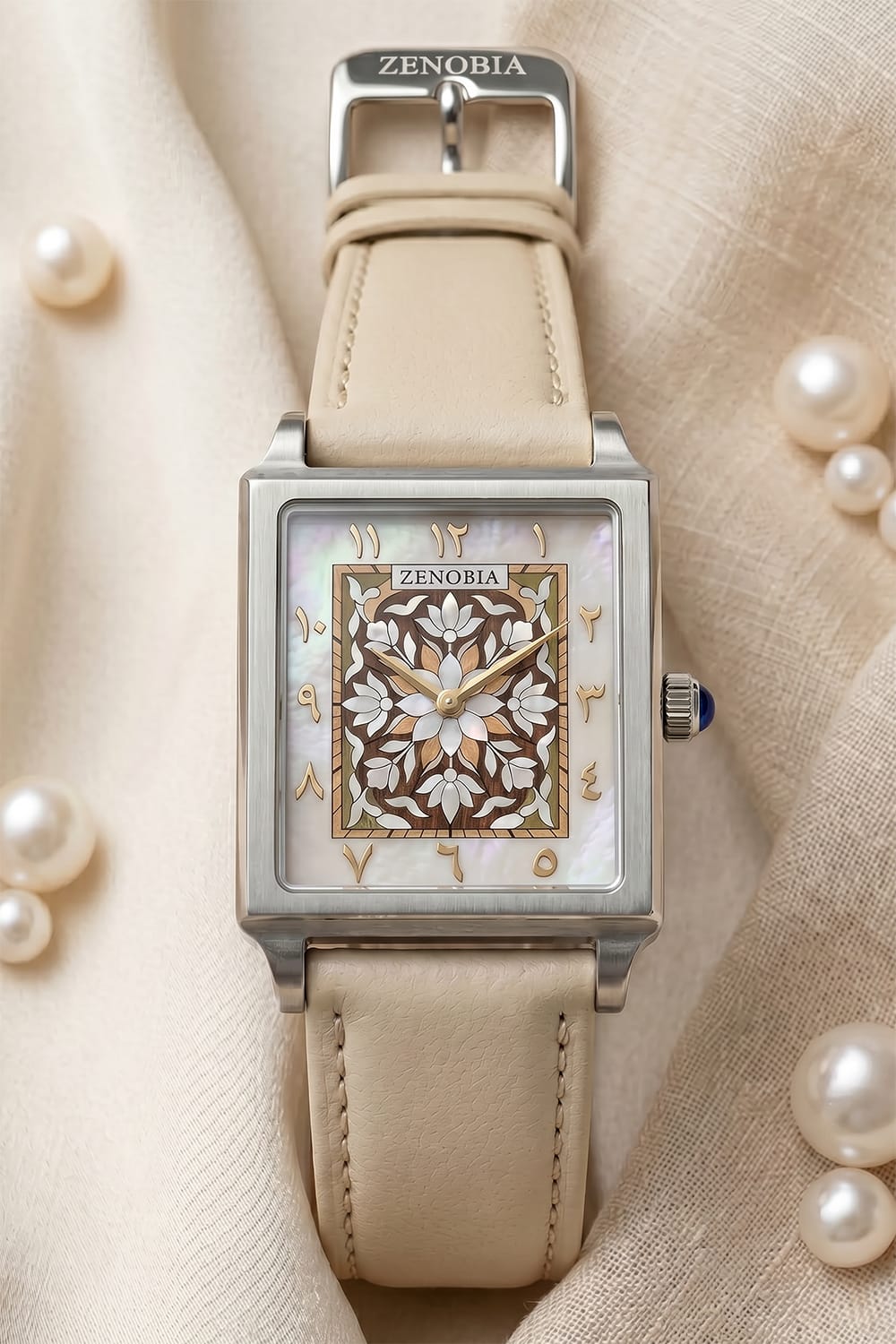 Ivory-strapped Zenobia watch surrounded by softly luminous pearls